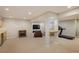 Large finished basement with wet bar, media area, and exercise equipment at 1009 Monarch Way, Superior, CO 80027
