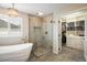 Bright bathroom with a glass shower, standalone tub and ample storage in the walk-in closet at 1009 Monarch Way, Superior, CO 80027