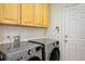 Well-equipped laundry room with modern LG washer and dryer and storage cabinets at 1009 Monarch Way, Superior, CO 80027