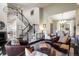 Open living area with staircase, hardwood floors, and stylish furniture, creating a comfortable and inviting atmosphere at 1009 Monarch Way, Superior, CO 80027