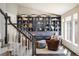 Comfortable sitting area with custom built-ins, natural light and hardwood floors at 1009 Monarch Way, Superior, CO 80027