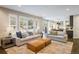 Open-concept living room featuring plantation shutters and seamless flow into the kitchen, perfect for modern living at 1009 Monarch Way, Superior, CO 80027
