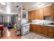 Functional kitchen with tile floors, light wood cabinets, and a view into the living room at 1910 S King St, Denver, CO 80219