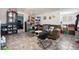 The living room features tile flooring, a comfortable sofa, and extra storage at 1910 S King St, Denver, CO 80219