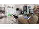 The living room features tile flooring, a comfortable sofa, and plenty of storage at 1910 S King St, Denver, CO 80219