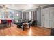 Inviting living room with hardwood floors, textured walls, neutral-toned furniture, and bright natural light at 1910 S King St, Denver, CO 80219
