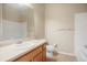 Bathroom includes a single sink, tile flooring, toilet, and large mirror at 8467 Canyon Rim Cir # 302, Englewood, CO 80112