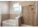 Beautiful bathroom with tiled walls and tub, shower with glass door and rain shower head at 8467 Canyon Rim Cir # 302, Englewood, CO 80112