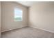 Bedroom features a window and neutral carpet at 8467 Canyon Rim Cir # 302, Englewood, CO 80112