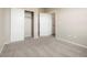 Bedroom with plush carpet and sliding closet doors at 8467 Canyon Rim Cir # 302, Englewood, CO 80112