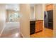 An interior showcasing a functional kitchen with stainless steel appliances and a spacious living area at 8467 Canyon Rim Cir # 302, Englewood, CO 80112