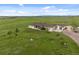 Sprawling ranch with rolling hills, a large home, and a private driveway at 15125 Spring Valley Rd, Larkspur, CO 80118