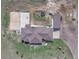Expansive property featuring a home, detached garage, basketball court, volleyball court, trampoline, and greenhouse at 15125 Spring Valley Rd, Larkspur, CO 80118