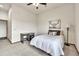 Minimalist bedroom with a single bed and desk with a neutral color palette at 15125 Spring Valley Rd, Larkspur, CO 80118