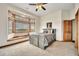 Bedroom featuring bay windows with scenic views and a rustic wooden bed frame for a cozy retreat at 15125 Spring Valley Rd, Larkspur, CO 80118