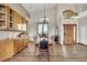 A large dining room features custom cabinets, vaulted ceiling and ample windows at 15125 Spring Valley Rd, Larkspur, CO 80118