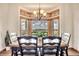 Eat-in dining space with large windows and a traditional chandelier at 15125 Spring Valley Rd, Larkspur, CO 80118