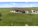 Sprawling ranch-style home with stone accents, attached garage, and picturesque mountain views at 15125 Spring Valley Rd, Larkspur, CO 80118