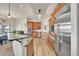 Spacious kitchen with stainless appliances, granite countertops, and island at 15125 Spring Valley Rd, Larkspur, CO 80118