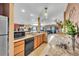Kitchenette with a sink, dishwasher, and a view into the home theatre area for easy snack access at 15125 Spring Valley Rd, Larkspur, CO 80118