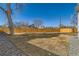 Large backyard with a wooden fence, offering privacy and plenty of space for outdoor activities at 8985 Lander St, Westminster, CO 80031