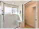 Modern bathroom with white subway tile shower, glass door and river rock floor at 8985 Lander St, Westminster, CO 80031