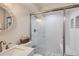 Modern bathroom featuring sleek white subway tile and a glass-enclosed shower at 8985 Lander St, Westminster, CO 80031