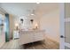 Bright bedroom featuring a white bed frame, wooden nightstands and bright window at 8985 Lander St, Westminster, CO 80031