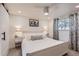 Bright bedroom featuring a white bed frame, soft carpet, and a modern ceiling fan at 8985 Lander St, Westminster, CO 80031