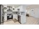 Modern kitchen with stainless steel appliances and white cabinets, ideal for culinary enthusiasts at 8985 Lander St, Westminster, CO 80031