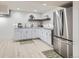Modern kitchen featuring stainless steel appliances and white cabinets at 8985 Lander St, Westminster, CO 80031