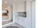 Bright laundry room with lots of cabinets and counter space for folding at 8985 Lander St, Westminster, CO 80031
