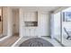 Bright laundry room with lots of cabinets and counter space for folding at 8985 Lander St, Westminster, CO 80031