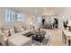 Open-concept living area with a view of the dining area, showcasing the home's seamless flow at 8985 Lander St, Westminster, CO 80031