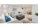 Bright living room boasts neutral tones, comfortable seating, and a stylish area rug, creating a welcoming and relaxing space at 8985 Lander St, Westminster, CO 80031