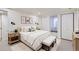 Inviting main bedroom showcases a comfortable bed, bedside tables, and a cozy window seat for relaxing at 8985 Lander St, Westminster, CO 80031