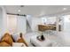 Finished basement features an open living space with a bar and countertop seating at 4818 Bryant St, Denver, CO 80221