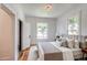 Cozy bedroom with hardwood floors, natural light, and neutral decor at 4818 Bryant St, Denver, CO 80221