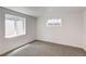 A simple bedroom featuring dual windows and a clean aesthetic at 4818 Bryant St, Denver, CO 80221