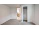 A tidy bedroom with a closet and access to other rooms at 4818 Bryant St, Denver, CO 80221