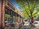 Inviting exterior of a coffee shop with outdoor seating along a vibrant city street at 4818 Bryant St, Denver, CO 80221