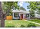 Street view of charming home with a manicured lawn, garden, and classic front door at 4818 Bryant St, Denver, CO 80221