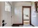 Welcoming foyer with classic trim, wood flooring, and convenient access to the living spaces at 4818 Bryant St, Denver, CO 80221