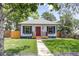 Charming single-story home with a red front door, fresh grass, and a sidewalk leading to the entrance at 4818 Bryant St, Denver, CO 80221