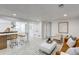 Open-concept living room with a kitchenette and a modern seating area with neutral colors at 4818 Bryant St, Denver, CO 80221