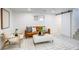 Cozy living room with a comfortable seating area, modern decor, and natural light from the window at 4818 Bryant St, Denver, CO 80221