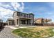 Exterior of house with backyard and patio with sliding glass doors at 27615 E Archer Ave, Aurora, CO 80018