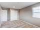 A bright bedroom features carpet floors, gray walls and a window with white blinds at 27615 E Archer Ave, Aurora, CO 80018