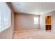 Bright bedroom with carpet and views to the ensuite bath at 27615 E Archer Ave, Aurora, CO 80018