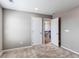 Bedroom features an open doorway to a hall and a stairway at 27615 E Archer Ave, Aurora, CO 80018